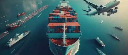Aerial view of a container ship with an airplane overhead